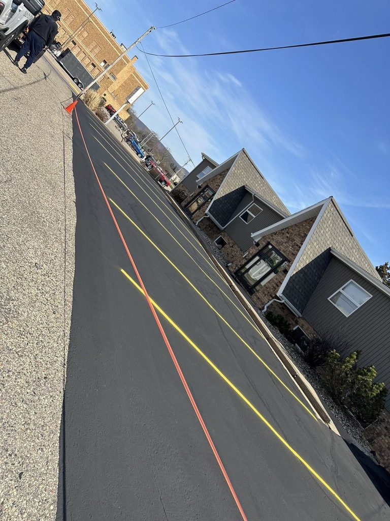 Commercial parking lot sealcoating with clear yellow line striping by Cimaroli Sealcoating in Baraboo, WI.