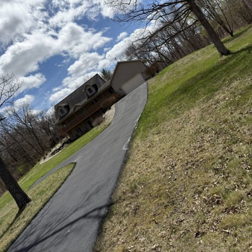 Residential driveway repair and sealcoating project completed by Cimaroli Sealcoating in Wisconsin Dells.
